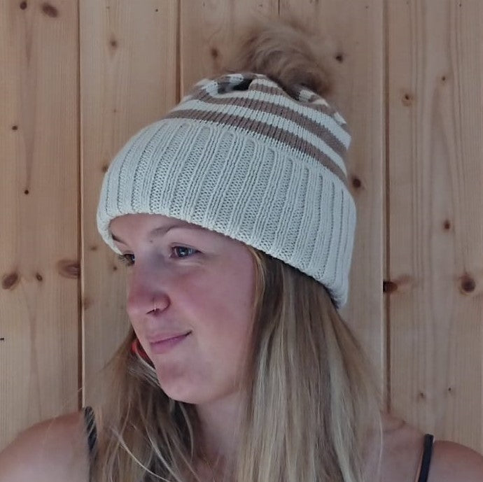 Clara wearing our Off-white and Sandstone Classic Ready to Wear hat with bronze faux pompom