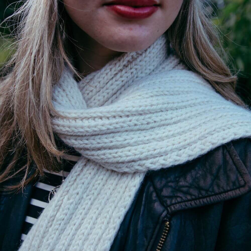 Model wearing chunky alpaca Seaman's scarf – shown in Parchment.