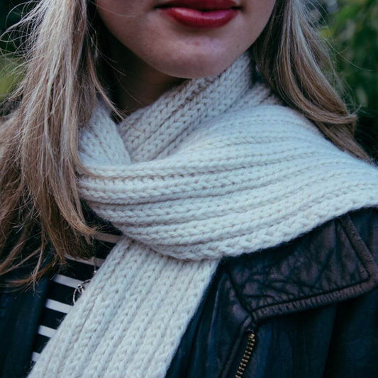 Model wearing chunky alpaca Seaman's scarf – shown in Parchment.