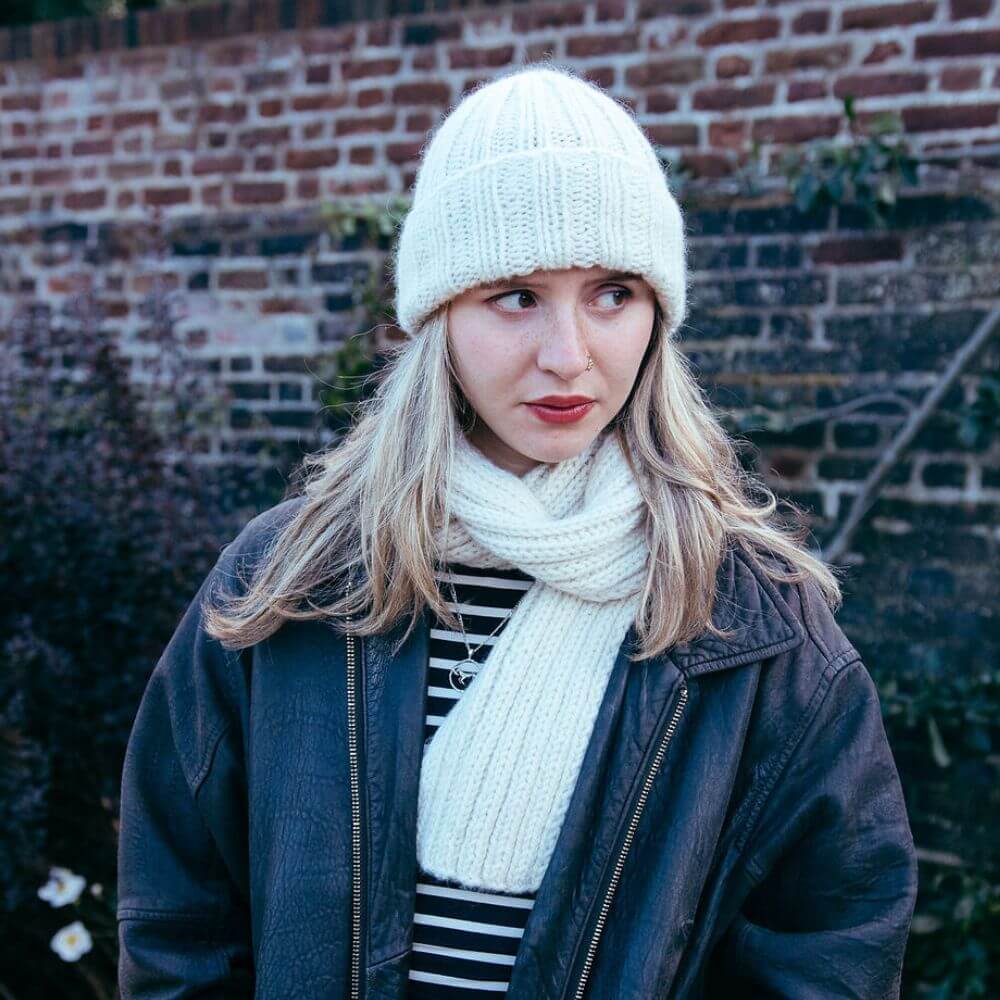  Model wearing chunky alpaca Seaman's hat  knitted from Gorgeous Alpacas pattern – shown in Parchment.