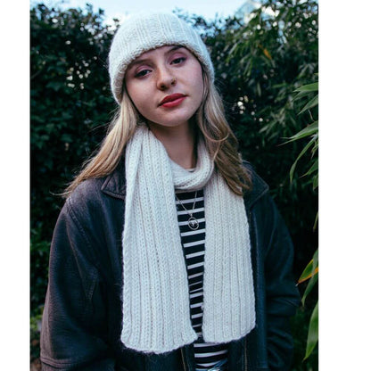 Model wearing chunky alpaca Seaman's hat and scarf knitted from Gorgeous Alpacas pattern – shown in Parchment.