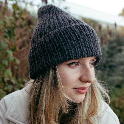 Model wearing chunky alpaca Seaman's hat knitted from Gorgeous Alpacas pattern – shown in Speckledy Blue.
